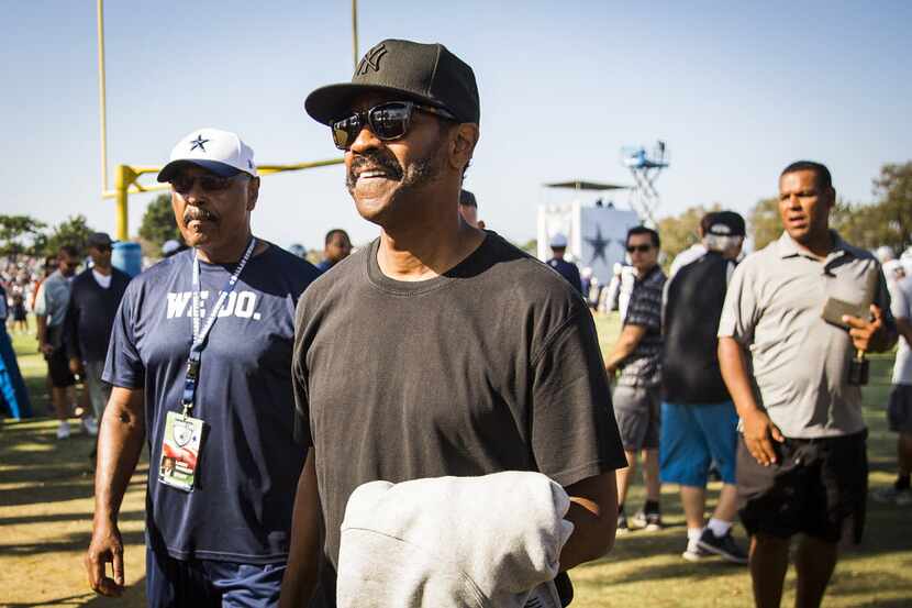 FILE - Actor Denzel Washington attends the Cowboys' afternoon practice at training camp on...