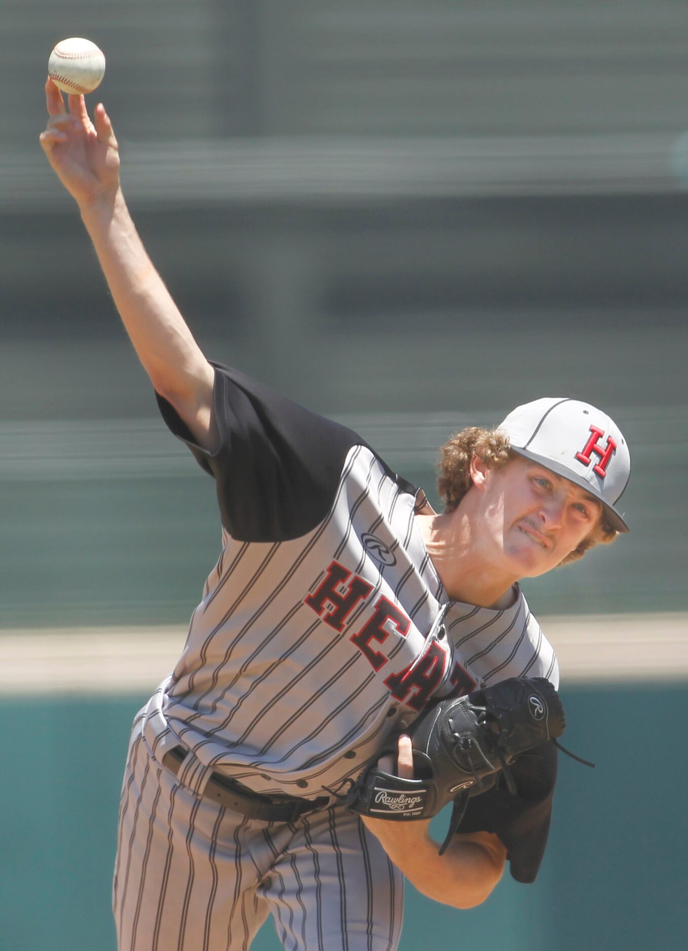 Rockwall Heath pitcher Baylor Baumann (1) delivers a pitch to a Rockwall batter during the...