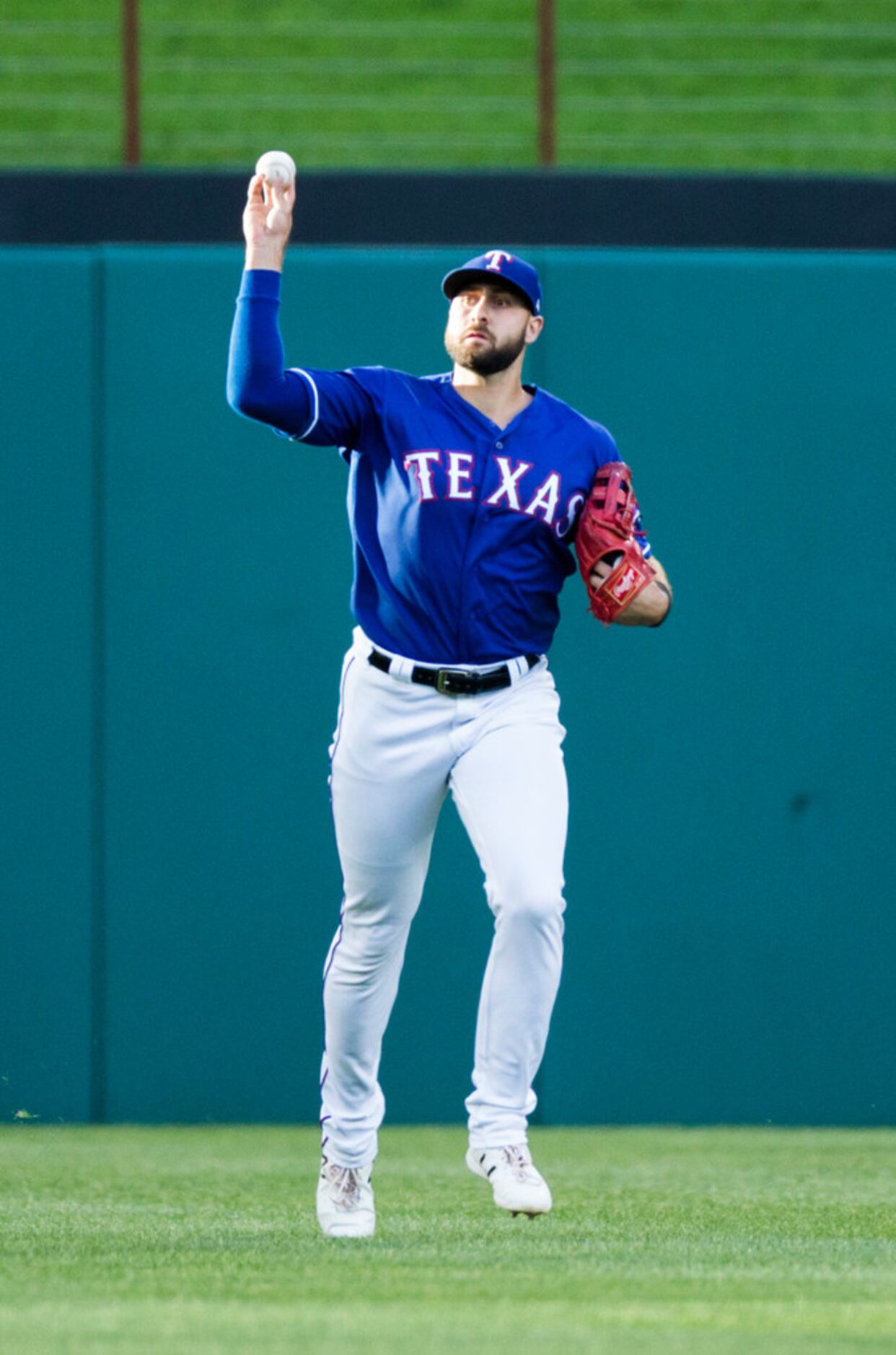 Texas Rangers center fielder Joey Gallo (13) throws back a fly ball to the outfield hit by...