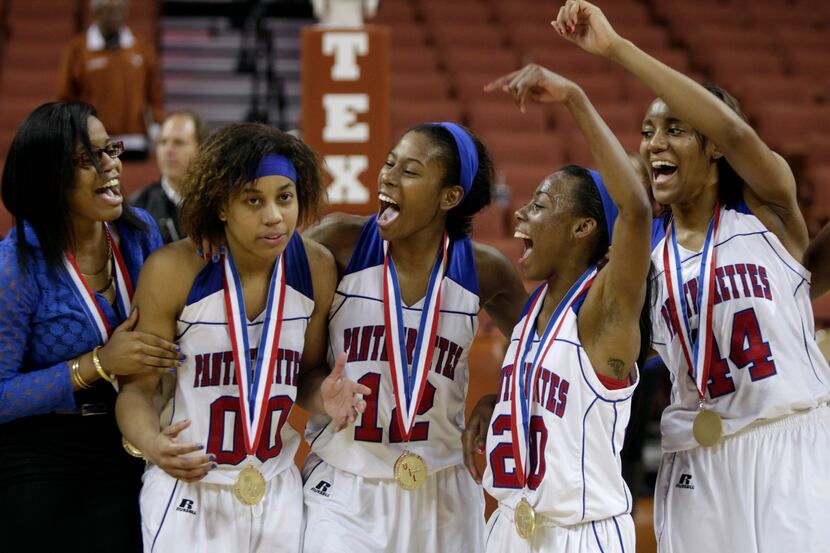 3/2/13  - Duncanville's Kiara Perry (00) is cheered on by her teammates after being...