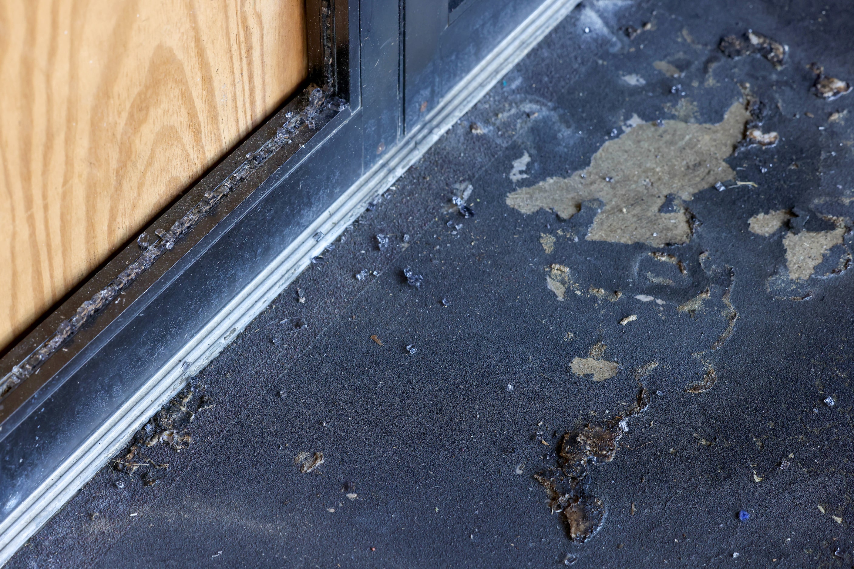 Pieces of glass from the doorway of Community Unitarian Universalist Church of Plano remain...