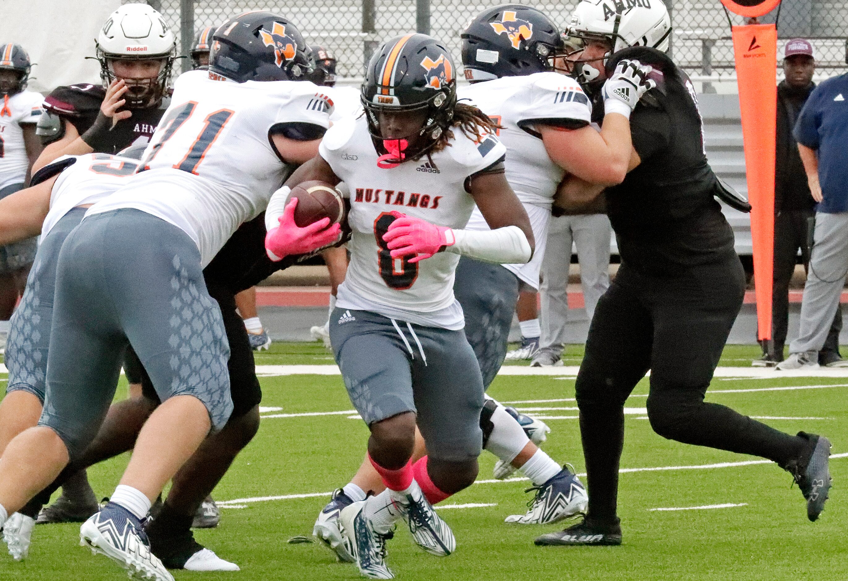 Sachse High School Joshua Ridge (8) runs the football during the first half as Wylie High...