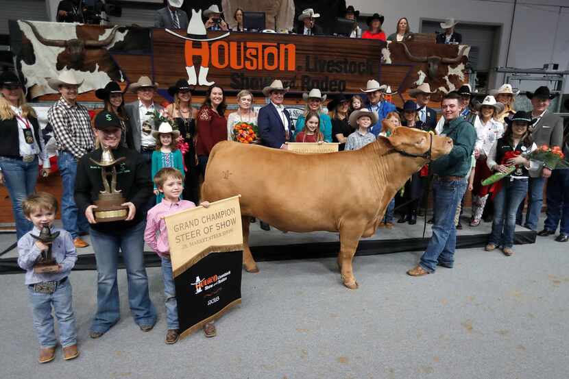 In this 2018 photo, Cameron Conkle poses with his steer Loki, which fetched $410,000 at the...