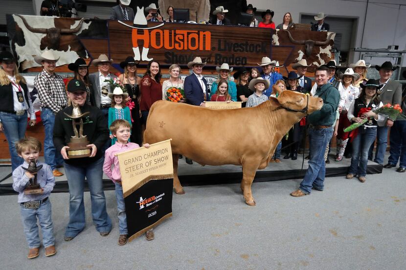 In this 2018 photo, Cameron Conkle poses with his steer Loki, which fetched $410,000 at the...