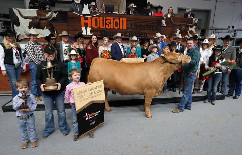 Cameron Conkle poses with his steer Loki, which fetched $410,000 at the Junior Market Steer...