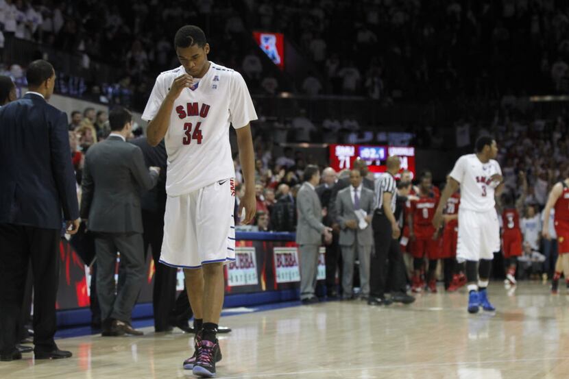 SMU's Ben Moore (34) walks off the court after losing to Louisville 84-71 at Moody Coliseum...