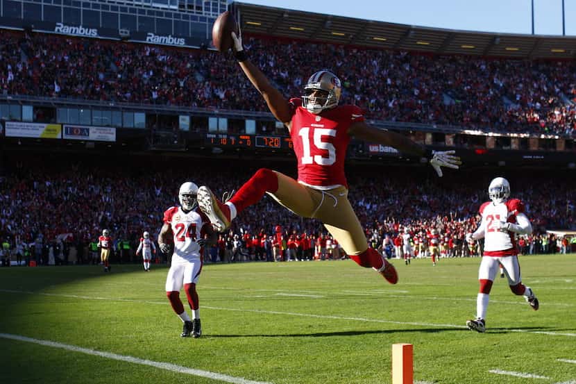 San Francisco 49ers wide receiver Michael Crabtree (15) scores on a 49-yard touchdown...