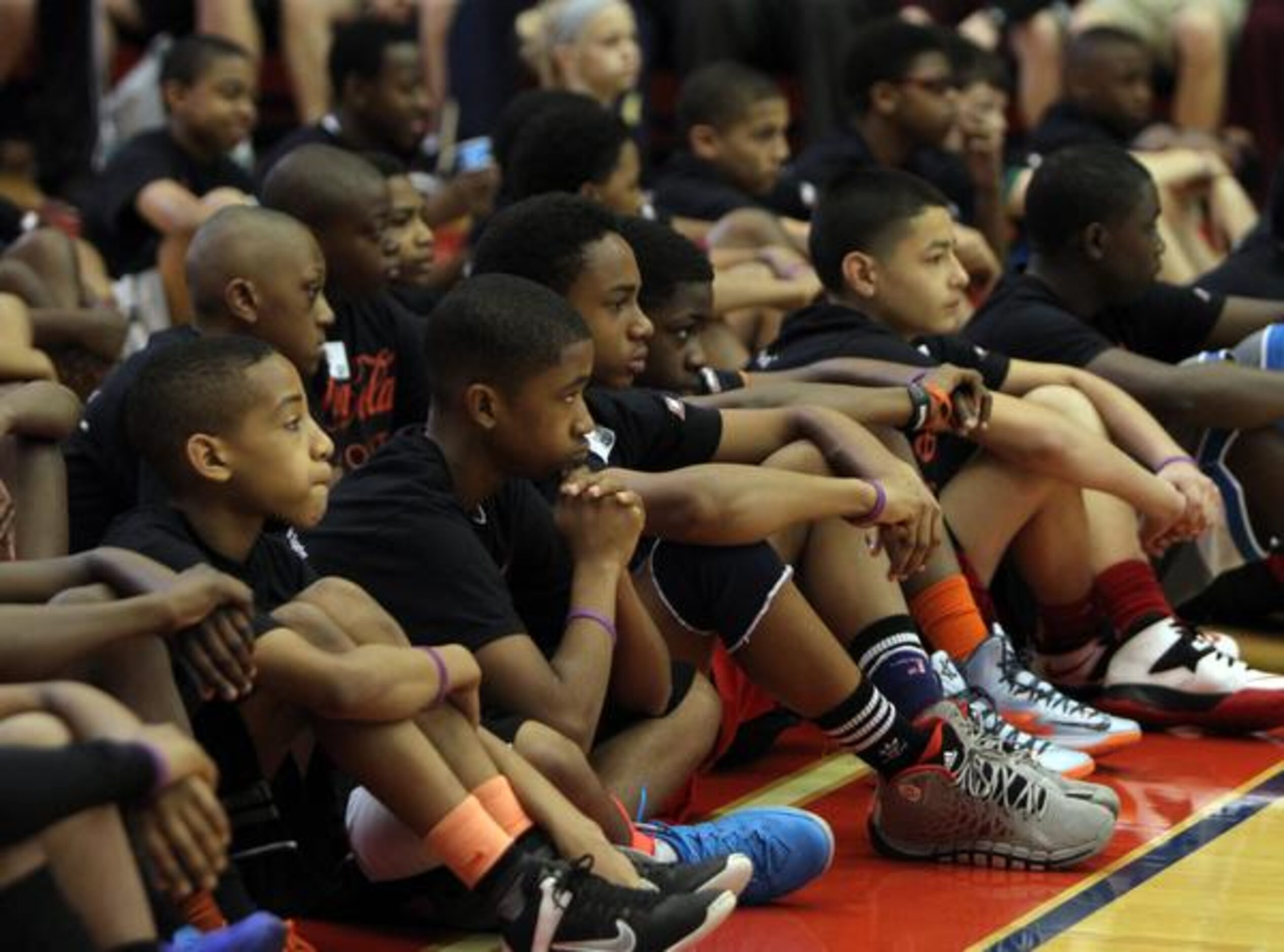 
Local youngsters listen intently to WNBA player and Duncanville High School standout Tamika...