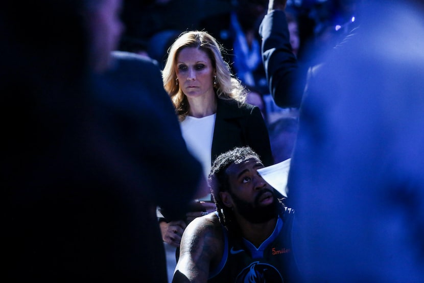 Mavericks assistant coach Jenny Boucek listens in the huddle during a break from play...