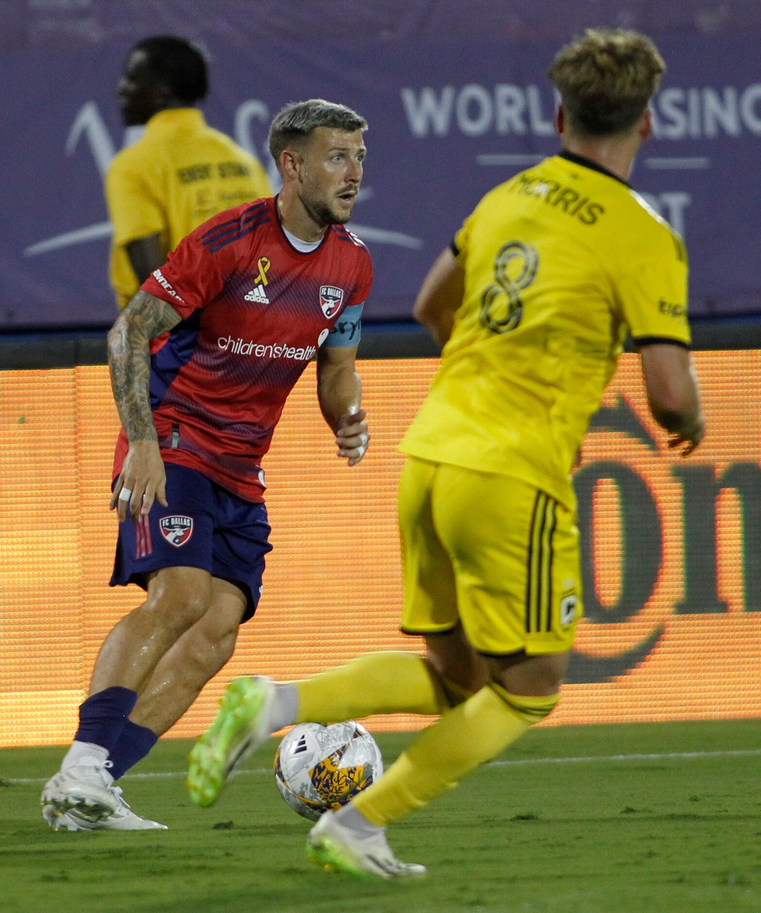 FC Dallas midfielder Paul Arriola (7) looks to pass to a teammate as Columbus midfielder...