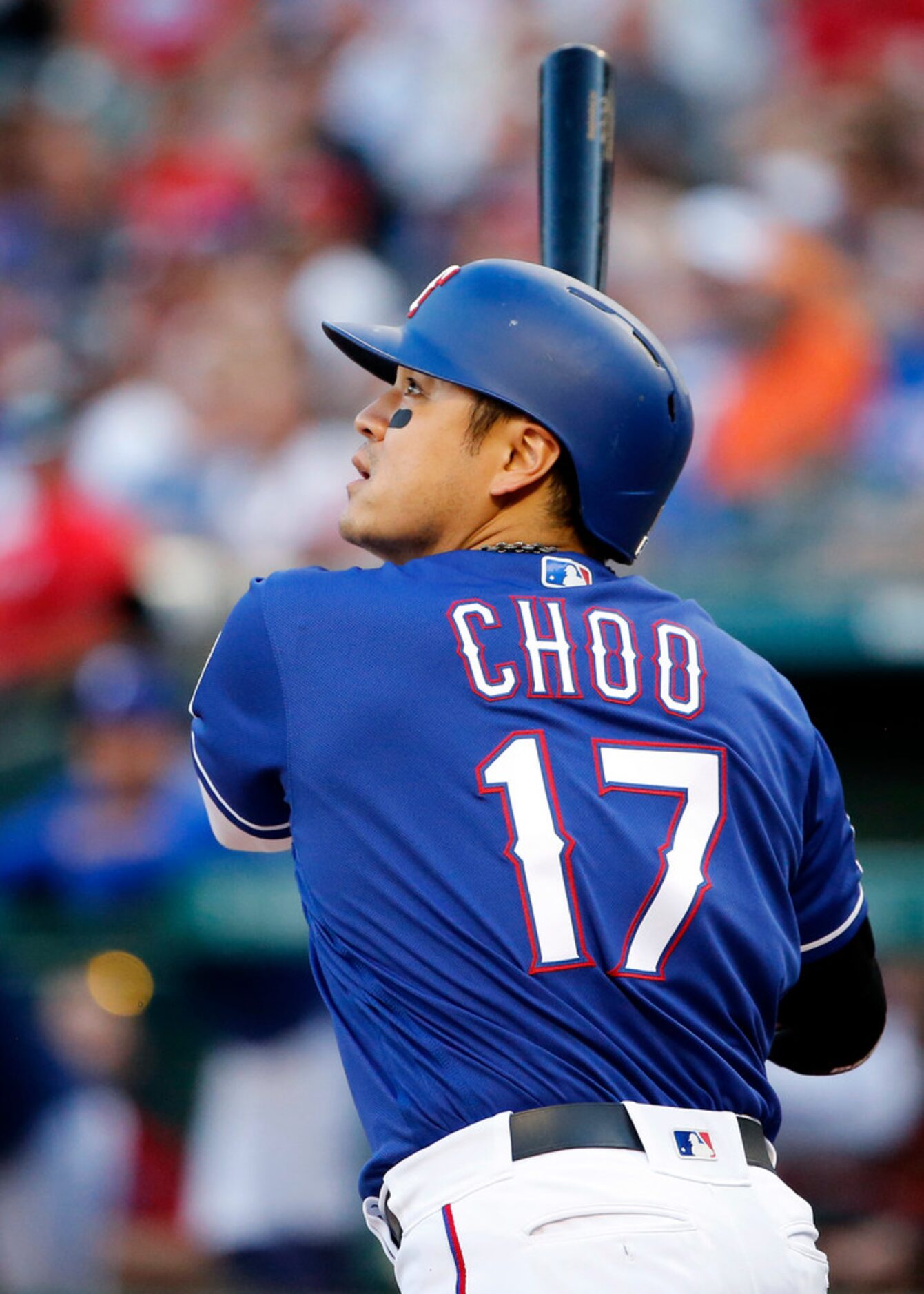 Texas Rangers batter Shin-Soo Choo (17) watches his first inning home run against the...