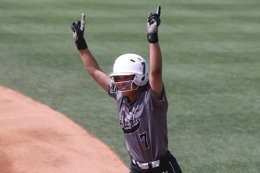 Denton Guyer's Tehya Pitts (7) celebrates reaching first base during the top of the first...