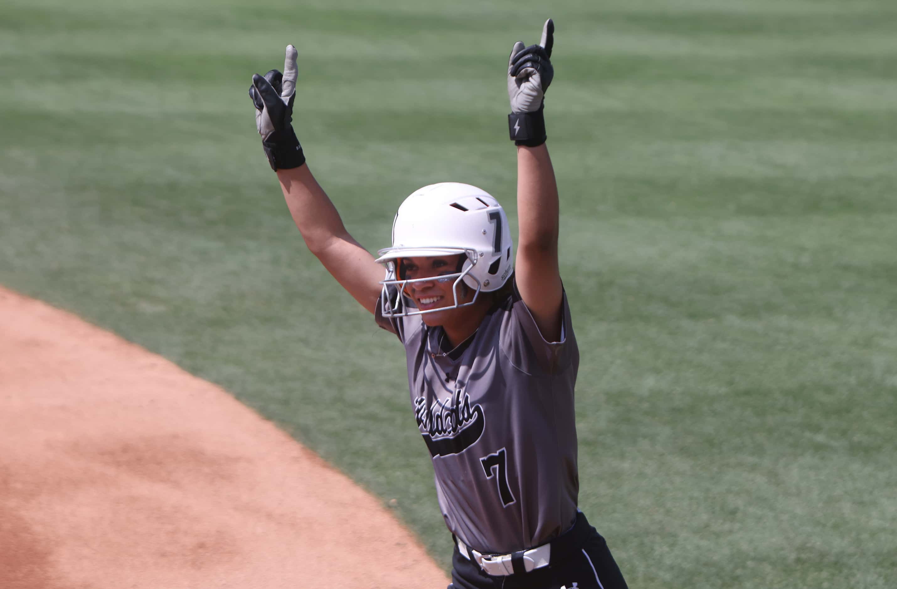 Denton Guyer's Tehya Pitts (7) celebrates reaching first base during the top of the first...