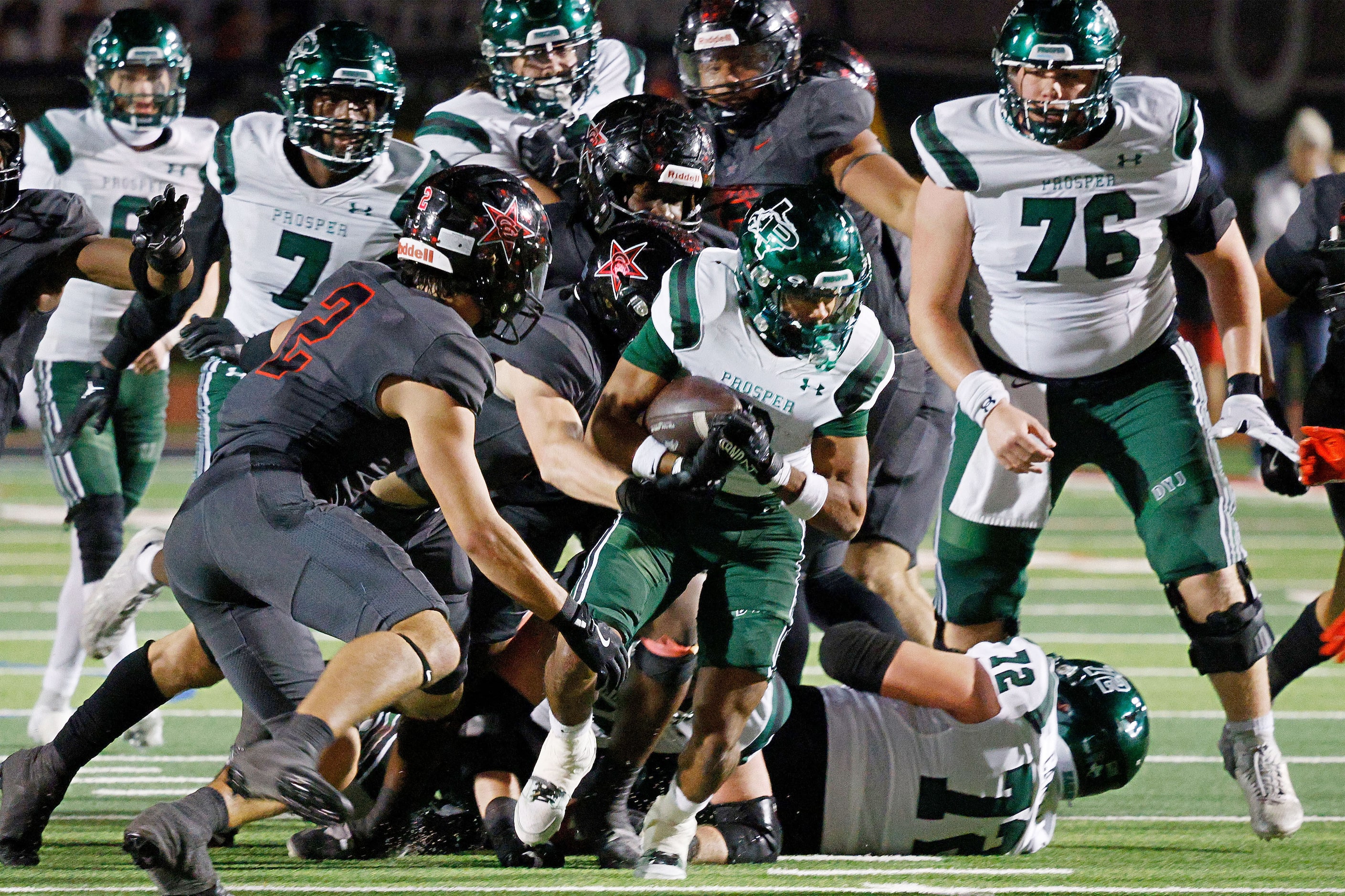 Prosper's Leo Anguiano (0) carries the ball against Coppell in the second half of a high...