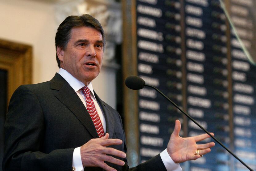 Gov. Rick Perry gives his State of the State speech in the Capitol's House chamber in...