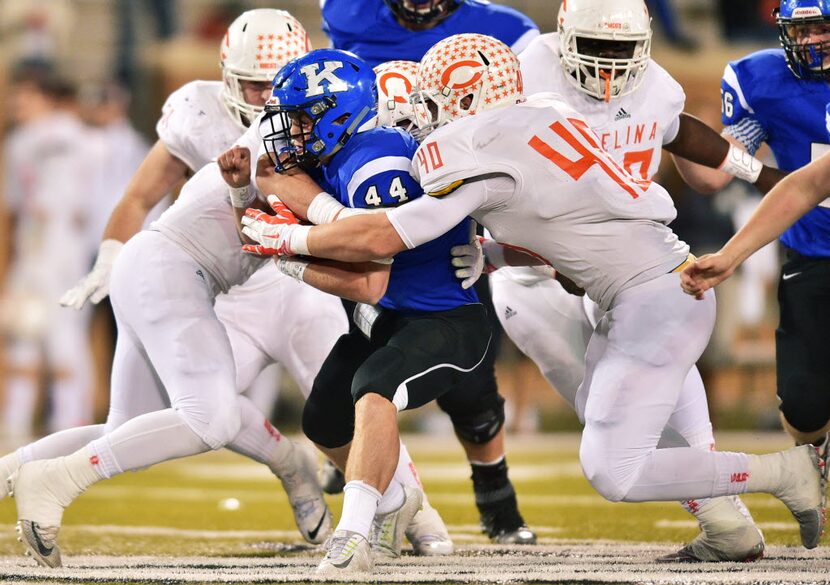 Krum junior running back Haeden Knight (44) tries to break through the Celina defense, in a...