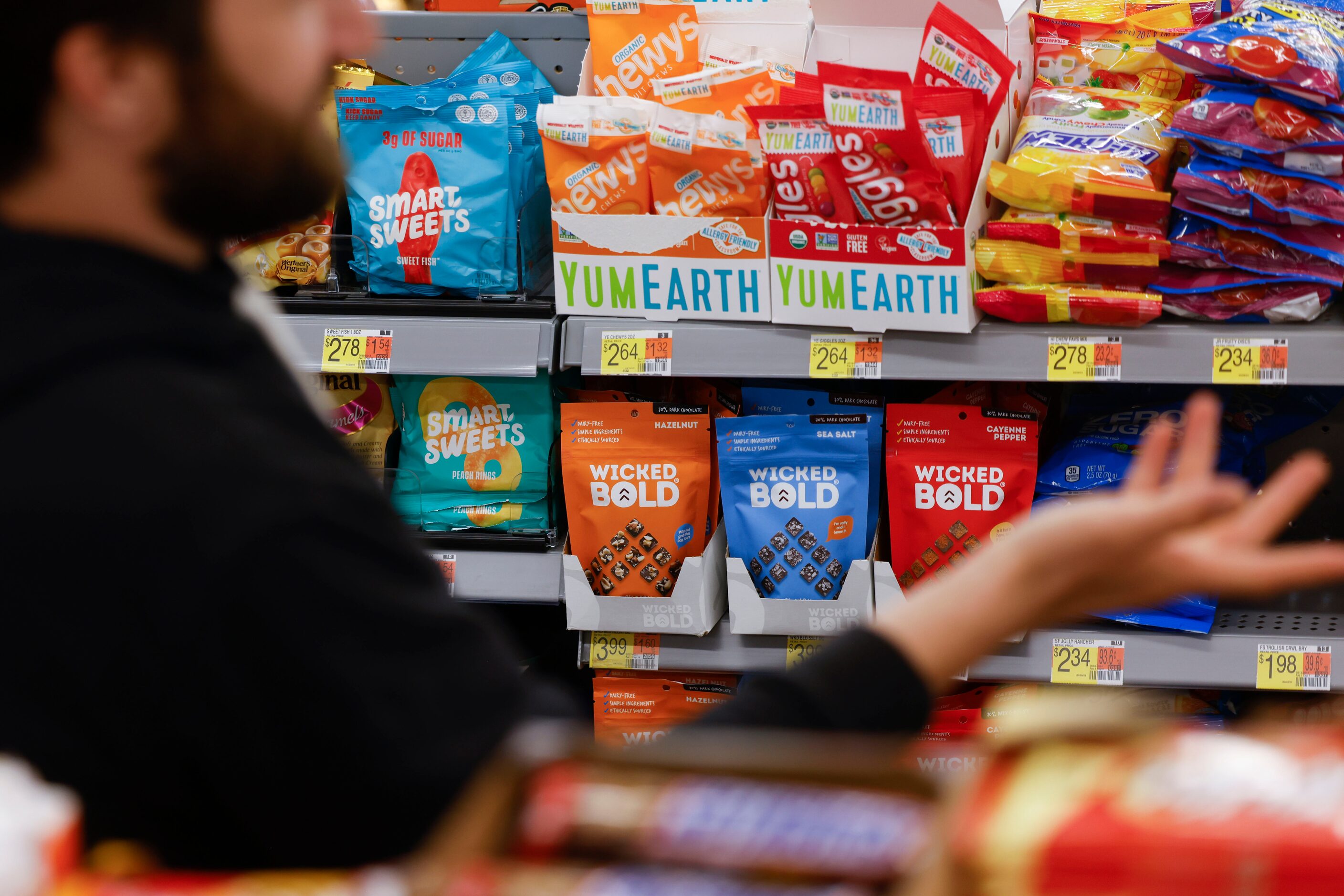 Packages of Wicked Bold chocolates are stacked in the "grap & go" section of Walmart in...