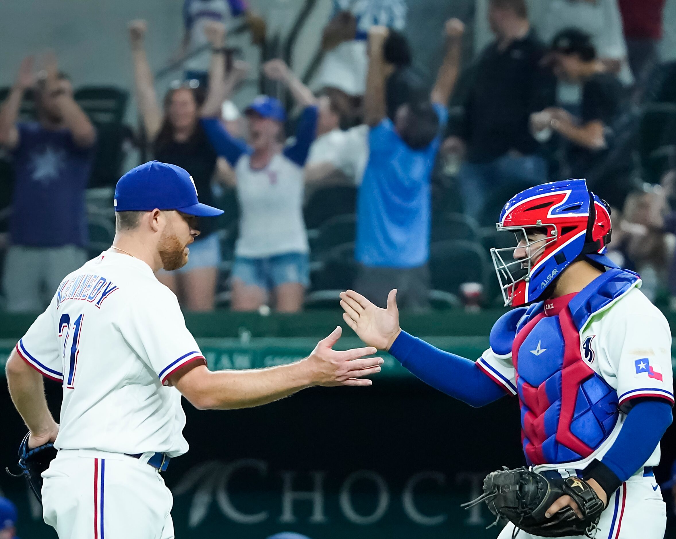 Texas Rangers relief pitcher Ian Kennedy celebrates with catcher Jose Trevino after the...