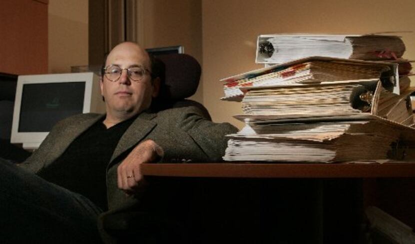 Kurt Eichenwald in his Dallas home in 2005, with some of the research materials being sold...