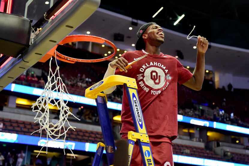 ANAHEIM, CA - MARCH 26:  Buddy Hield #24 of the Oklahoma Sooners smiles after cutting a...