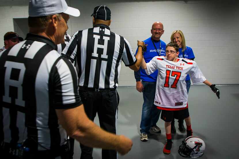 Make-A-Wish Foundation of North Texas guest Zachary, 12, of Fort Worth, got high-fives from...