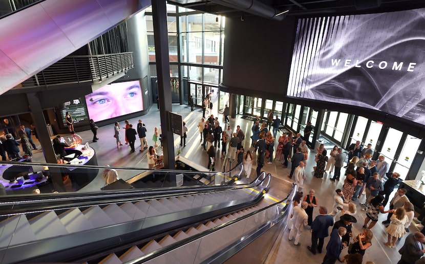 Guests check out the new facilities at Cosm, the big immersive dome venue, as it held its...