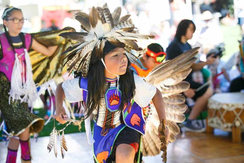 In this June 24, 2017, photo, Jessi Soliz dances as members of the Native American Cross...