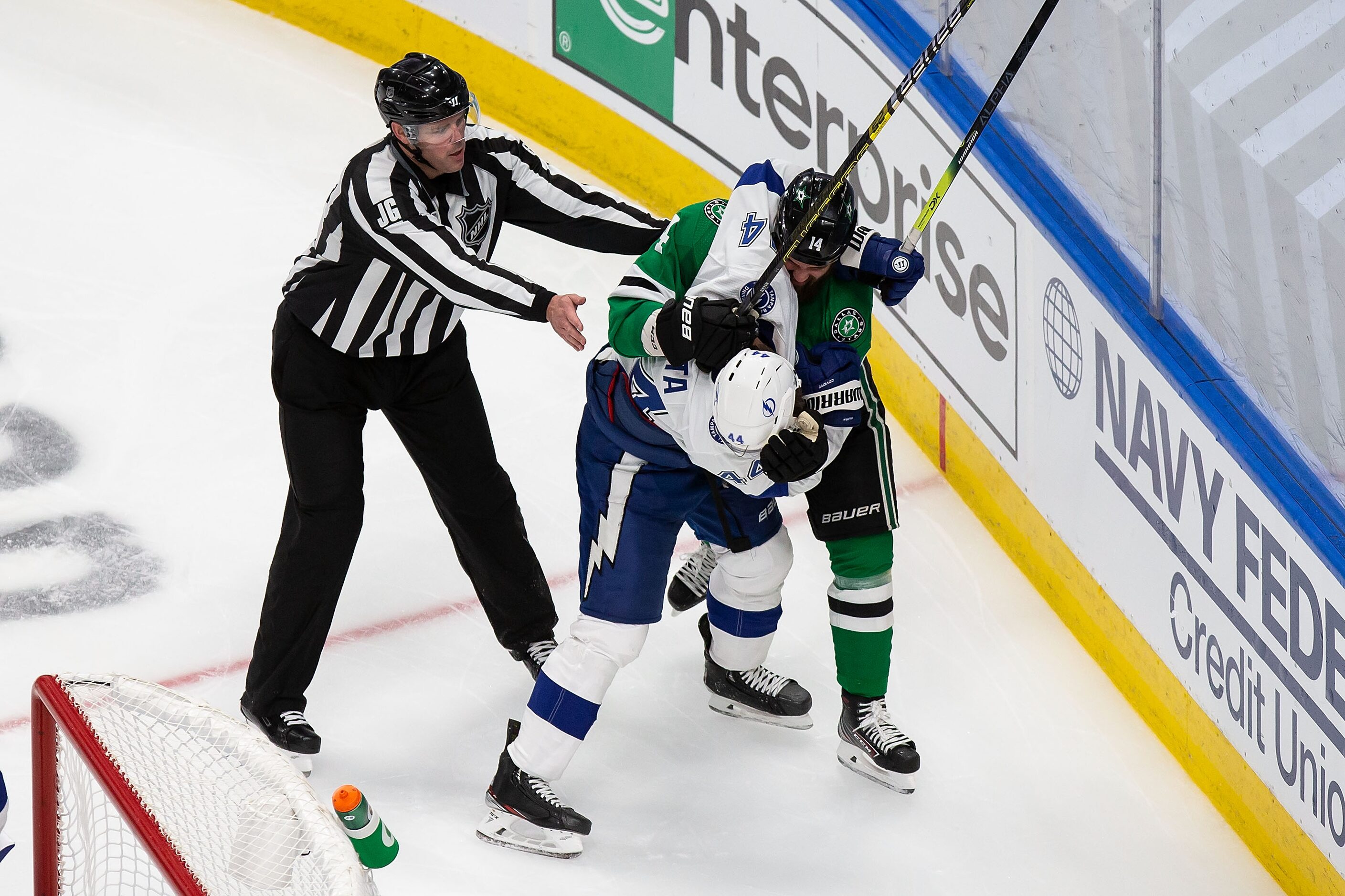 Jamie Benn (14) of the Dallas Stars battles against Jan Rutta (44) of the Tampa Bay...