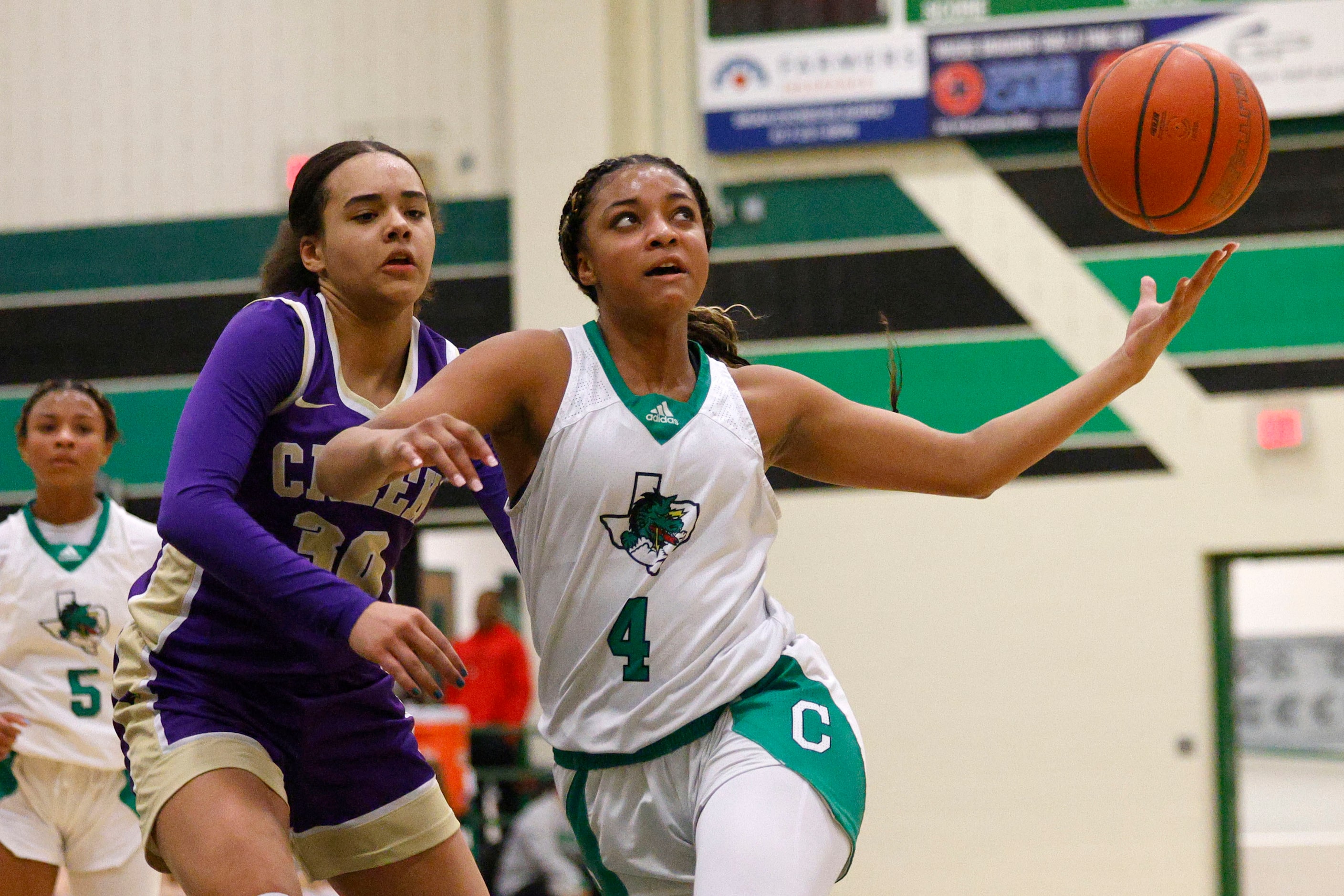 Southlake Carroll's Natalia Jordan (4) keeps the ball away from Keller Timber Creek's Kylee...