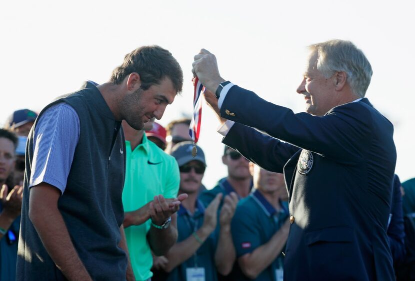 HARTFORD, WI - JUNE 18:  Amateur Scottie Scheffler of the United States is awarded a medal...