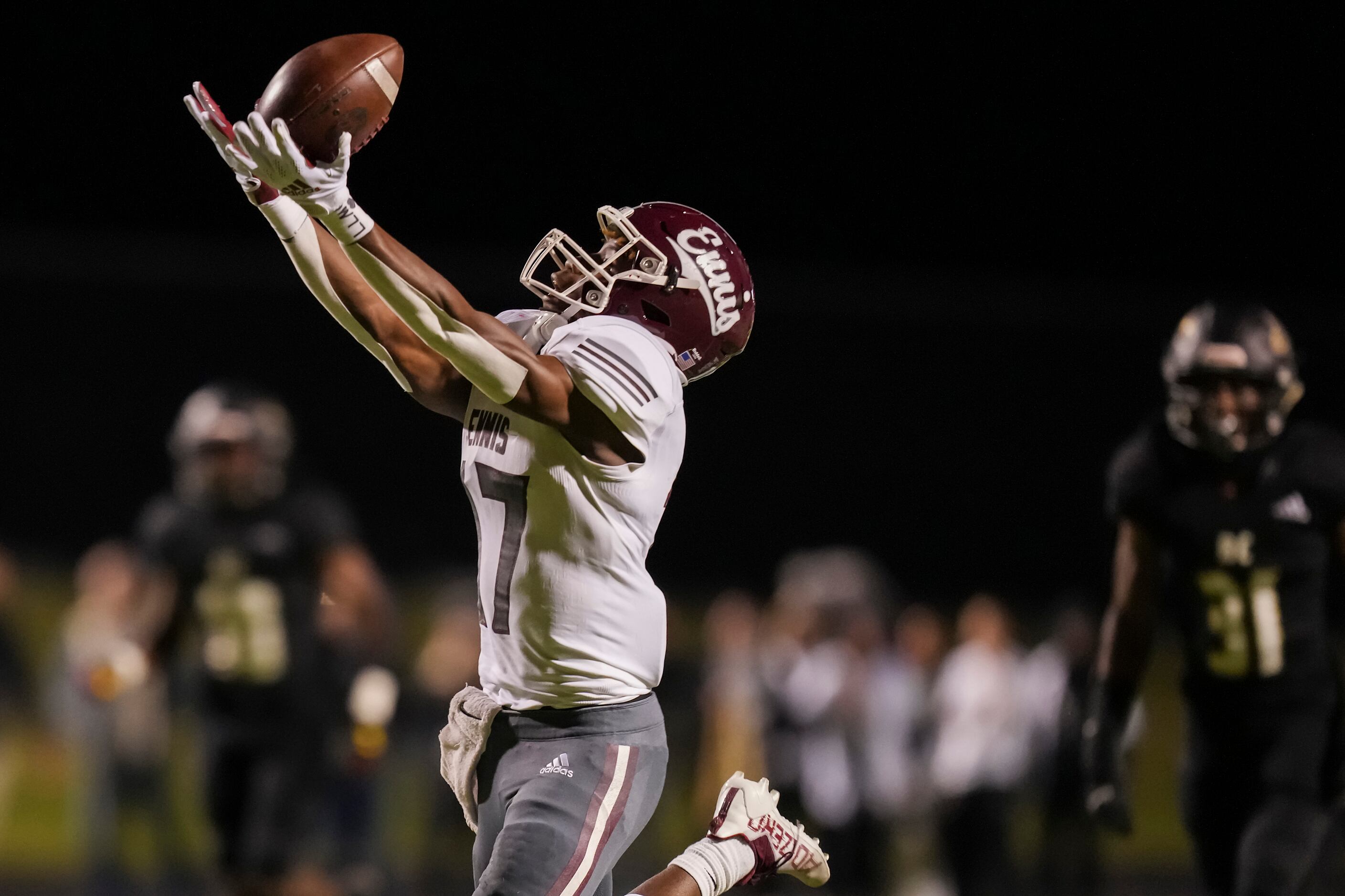 Ennis wide receiver T.T. Cox (17) hauls in a 52-yard touchdown pass during the first quarter...