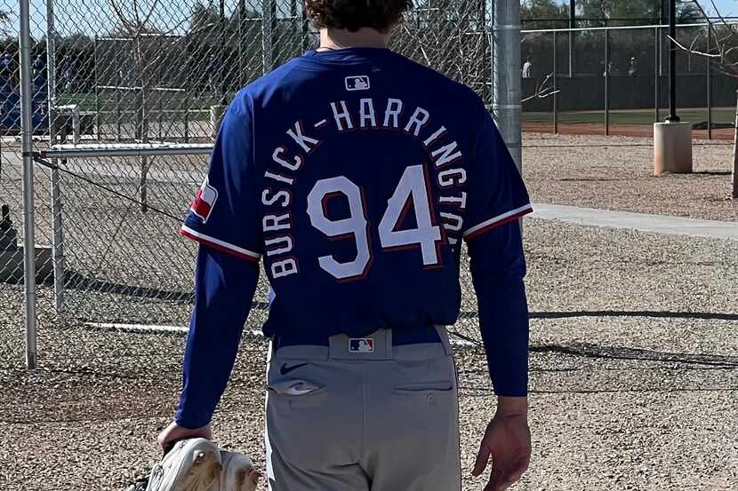 Texas Rangers pitcher Logan Bursick-Harrington, whose jersey carries 18 characters, could...