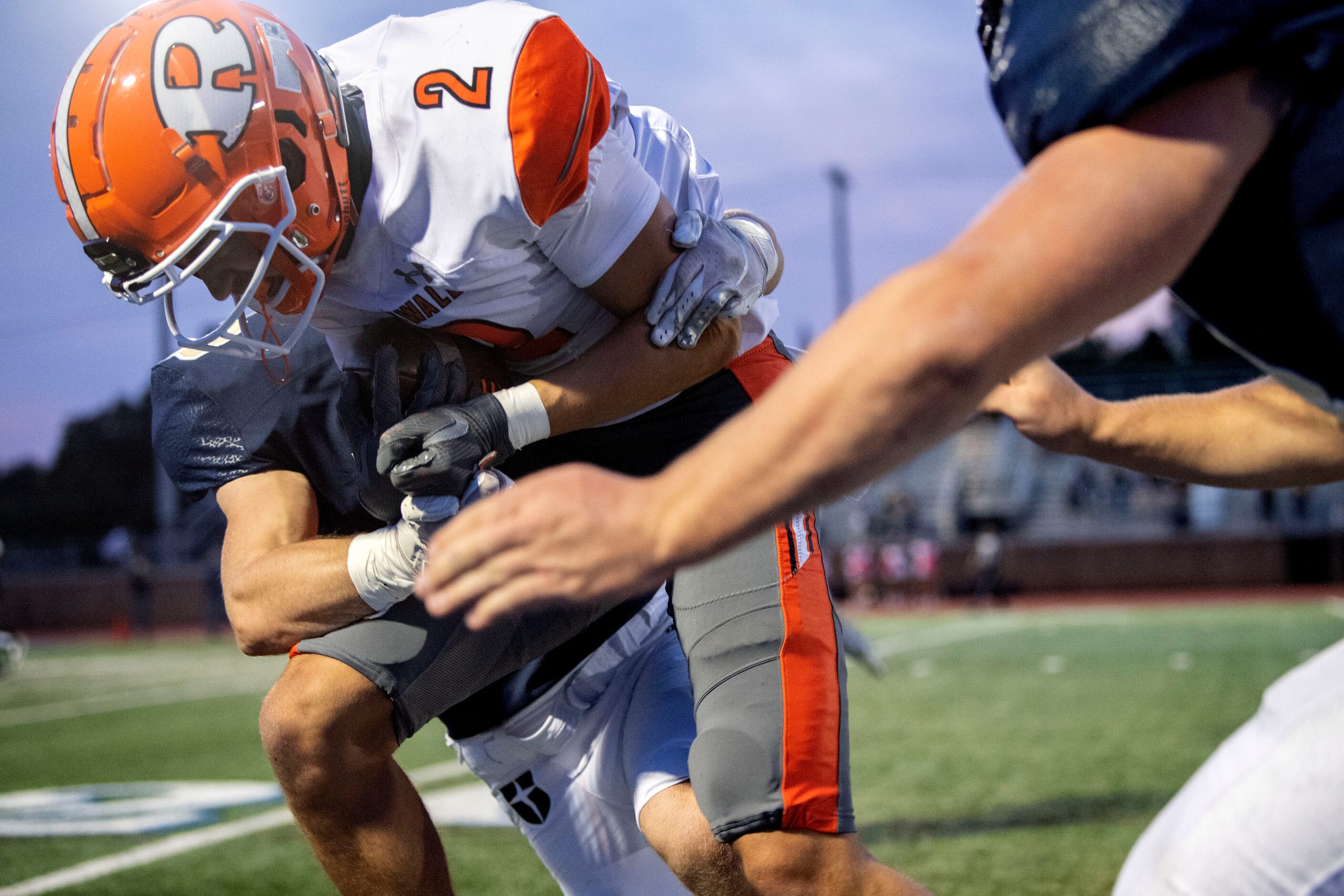 Rockwall senior wide receiver Brenden Bayes (2) is tackled by Jesuit junior linebacker Kyle...