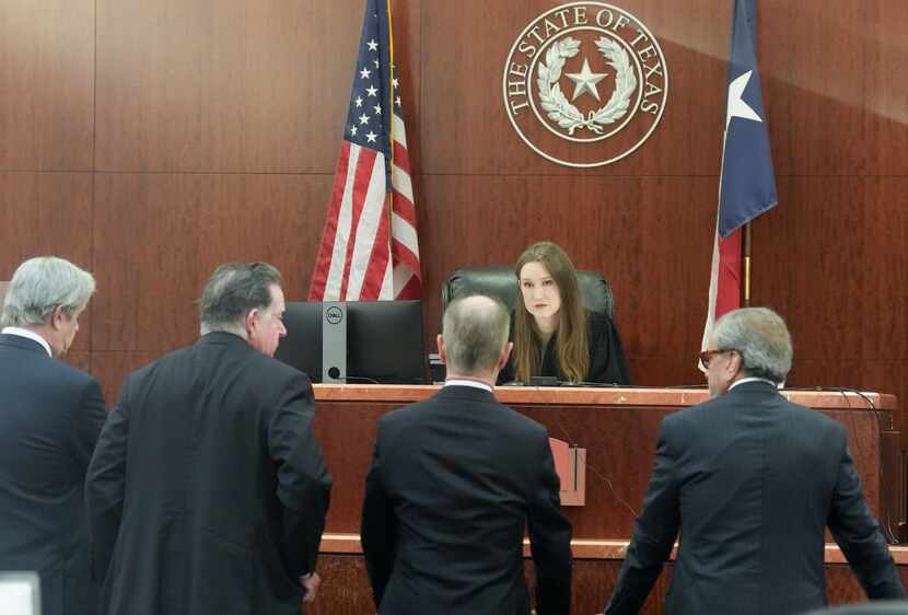 Defense and special prosecutors approach the bench of Judge Andrea Beall for suspended Texas...