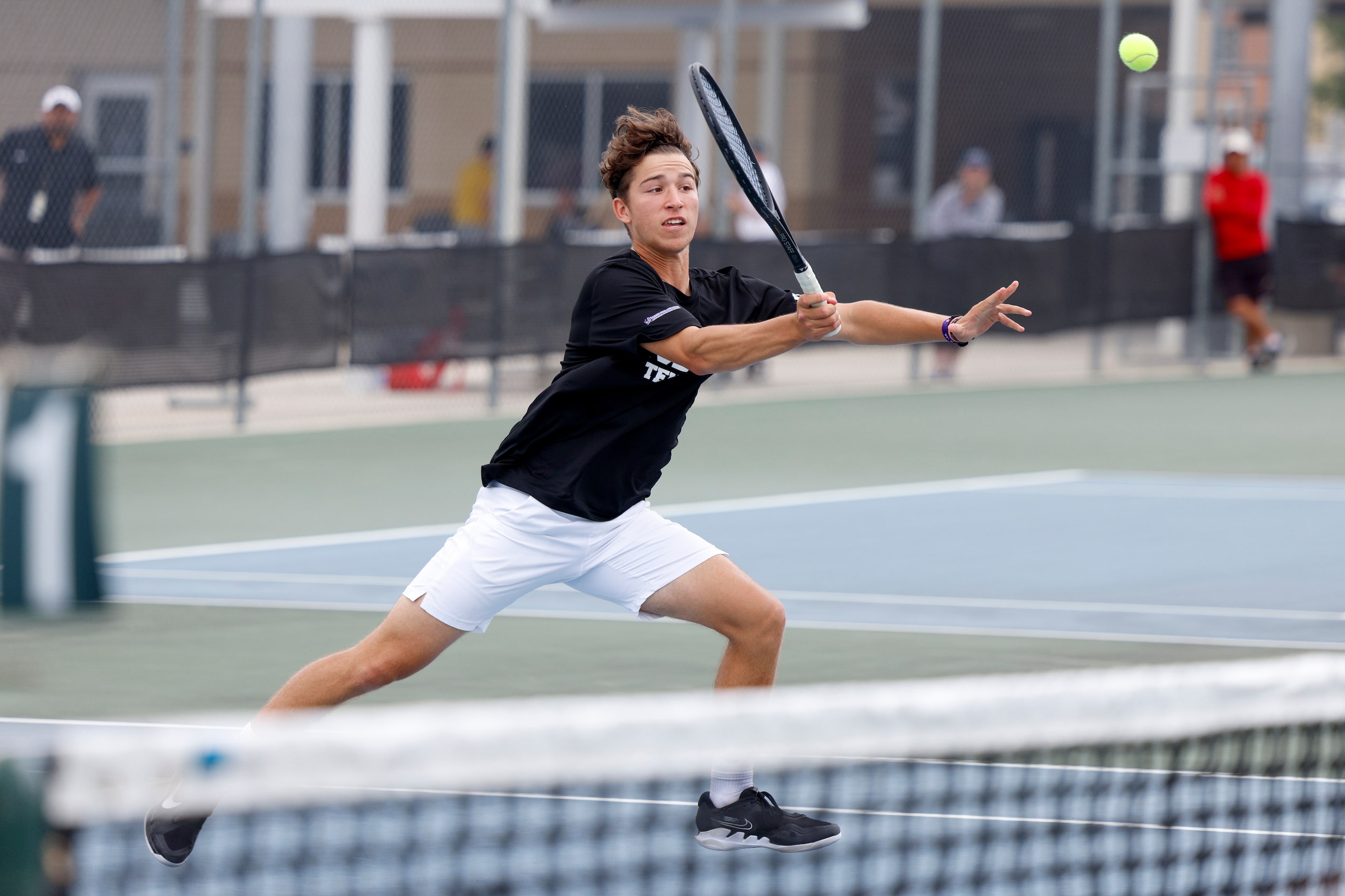 Plano West’s Ethan Scribner hits a volley during the 6A boys doubles championship match at...