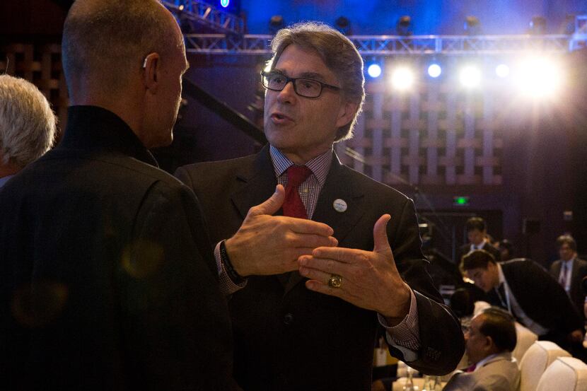 In this photo taken Wednesday, U.S. Energy Secretary Rick Perry attends the opening ceremony...