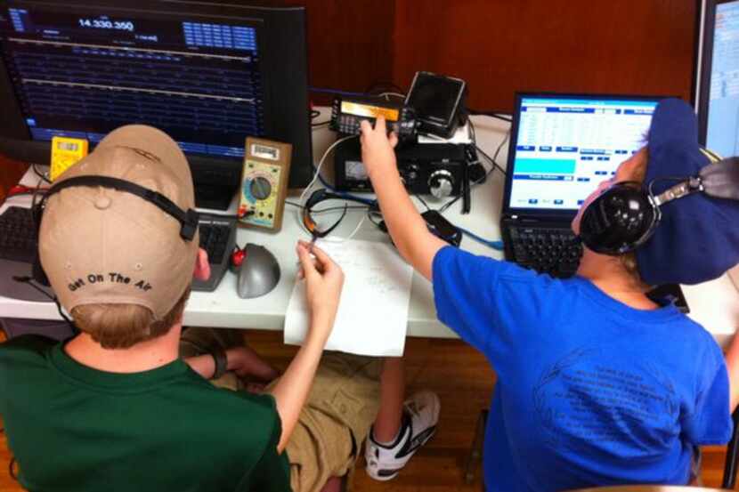 
Two boys broadcast signals during the Irving Amateur Radio Club’s Field Day in June. The...