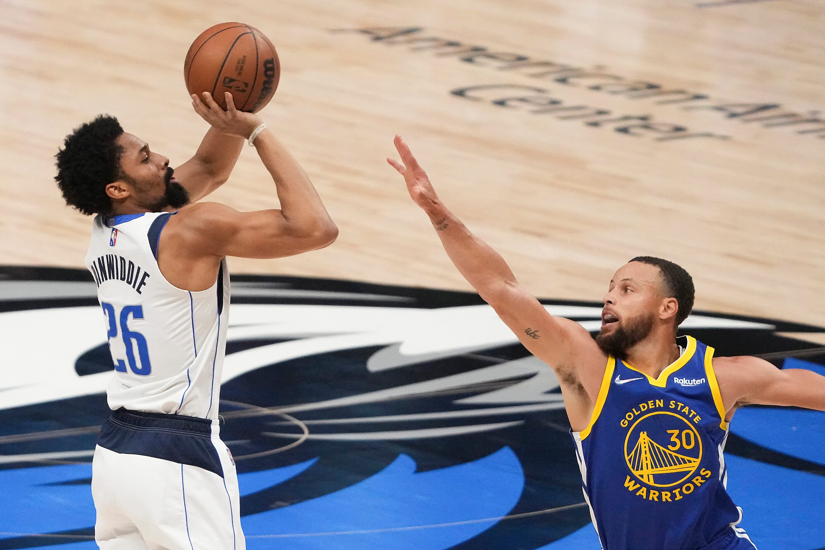 Dallas Mavericks guard Spencer Dinwiddie (26) shoots a 3-pointer over Golden State Warriors...