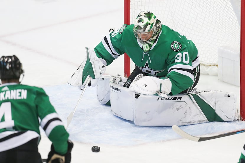 Dallas Stars goaltender Ben Bishop (30) blocks a shot on goal during the first period of a...