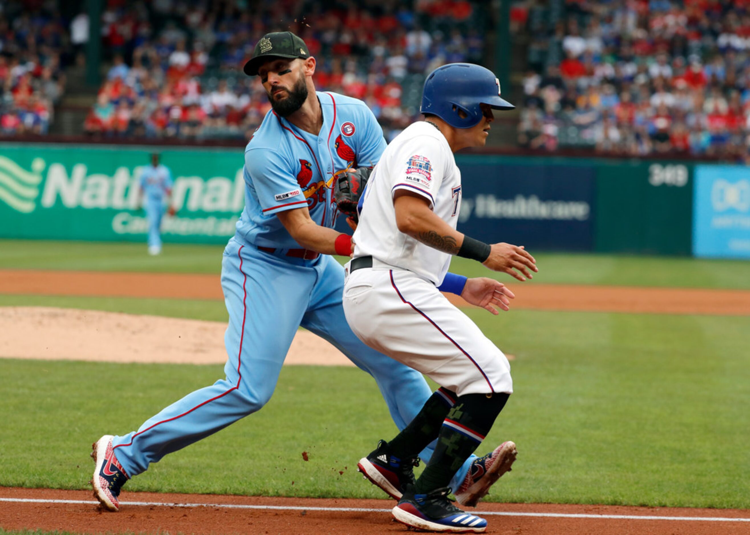 St. Louis Cardinals first baseman Matt Carpenter (13) tags out Texas Rangers' Shin-Soo Choo...