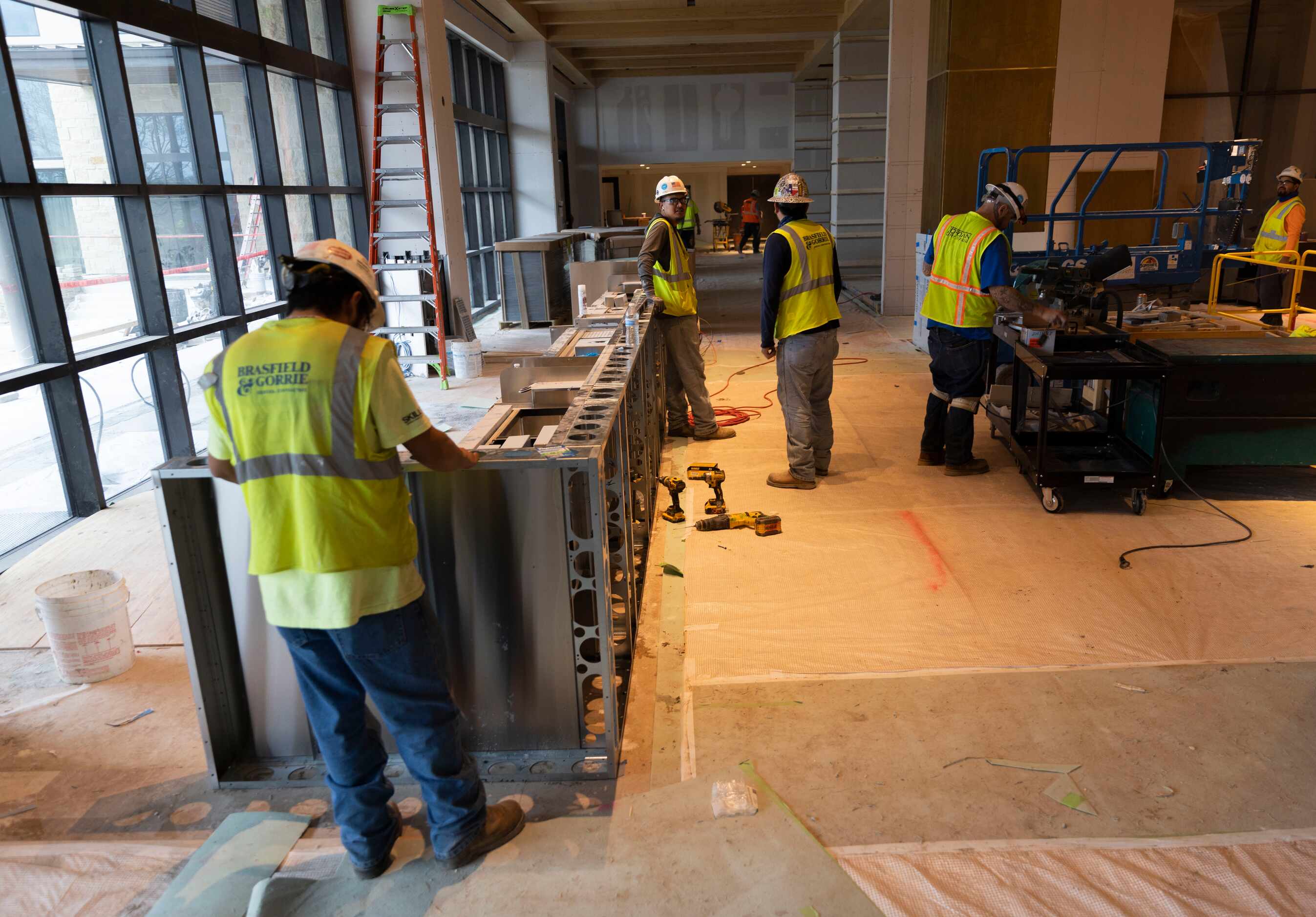Workers assemble what will be the resort's lobby bar.