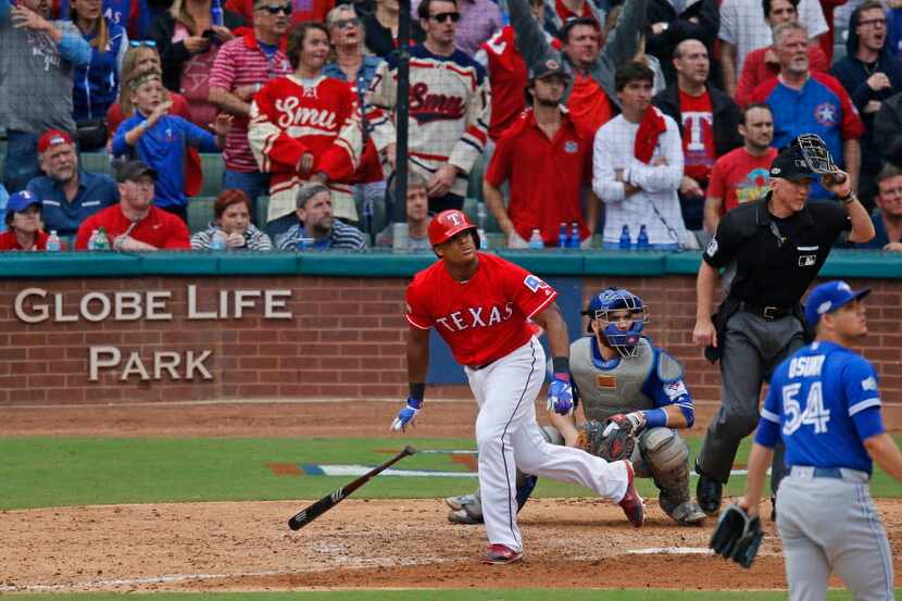 Texas Rangers third baseman Adrian Beltre (29) watches the flight of the ball during the...