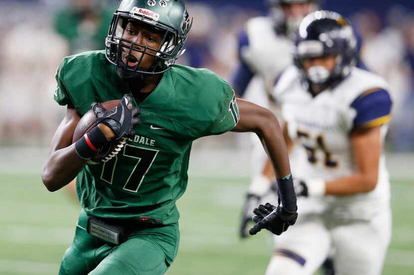 Kennedale's Jaden Smith (17) runs after the catch for a touchdown in a game against...