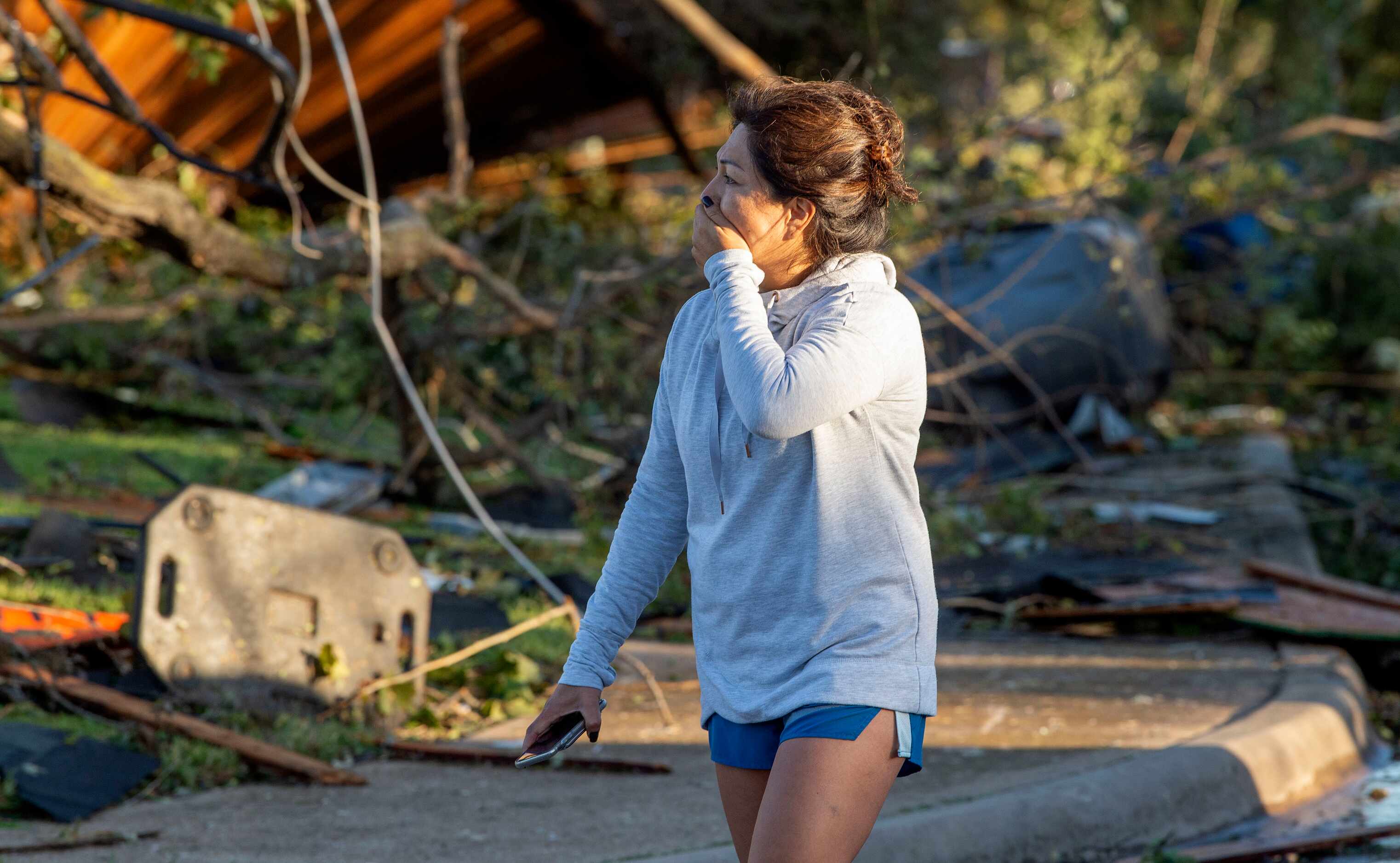 Maricela Chanaa reacts to seeing damage to her neighbors' houses caused by Sunday night's...