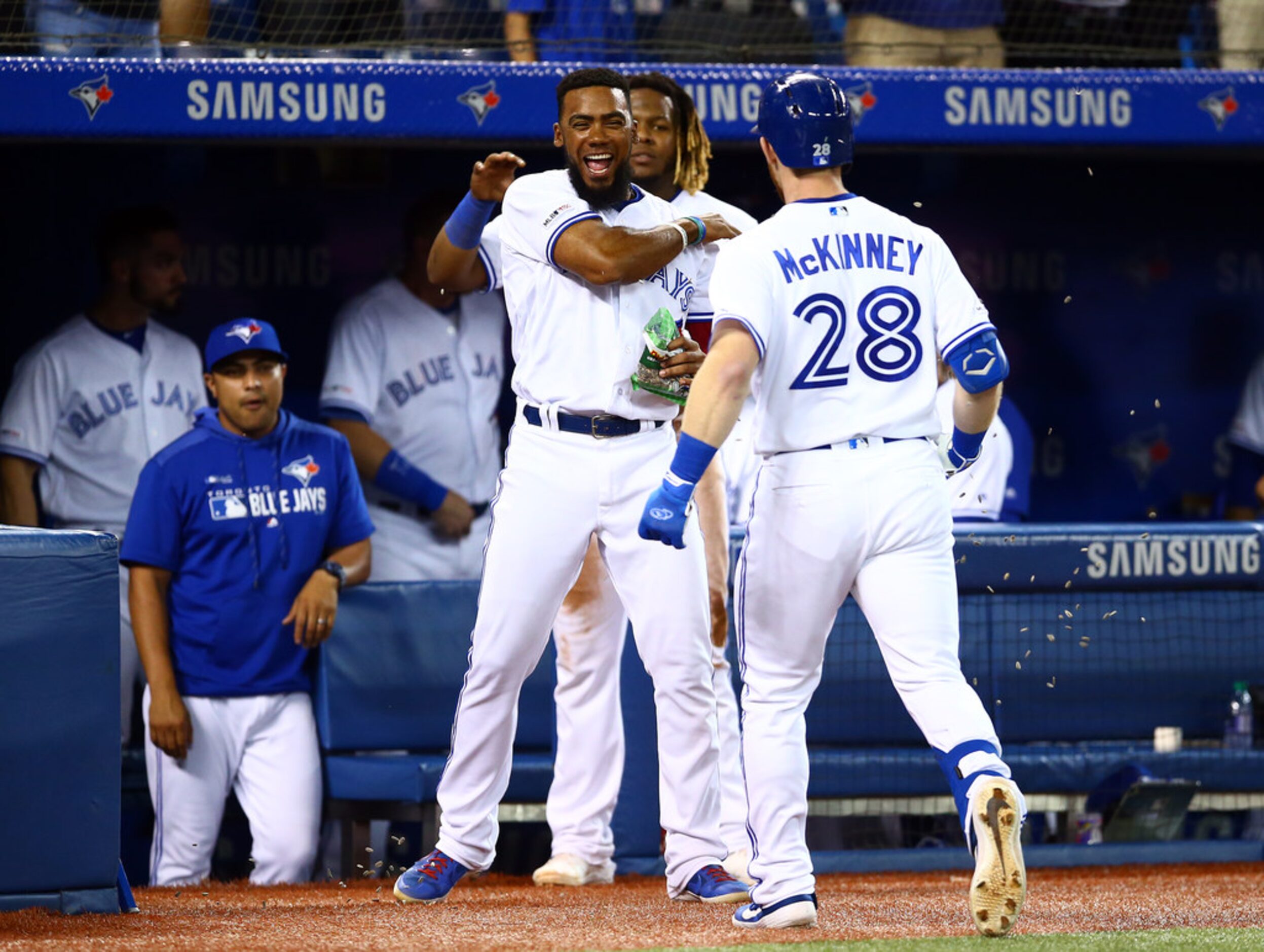 TORONTO, ON - AUGUST 13:  Billy McKinney #28 of the Toronto Blue Jays hits a solo home run...