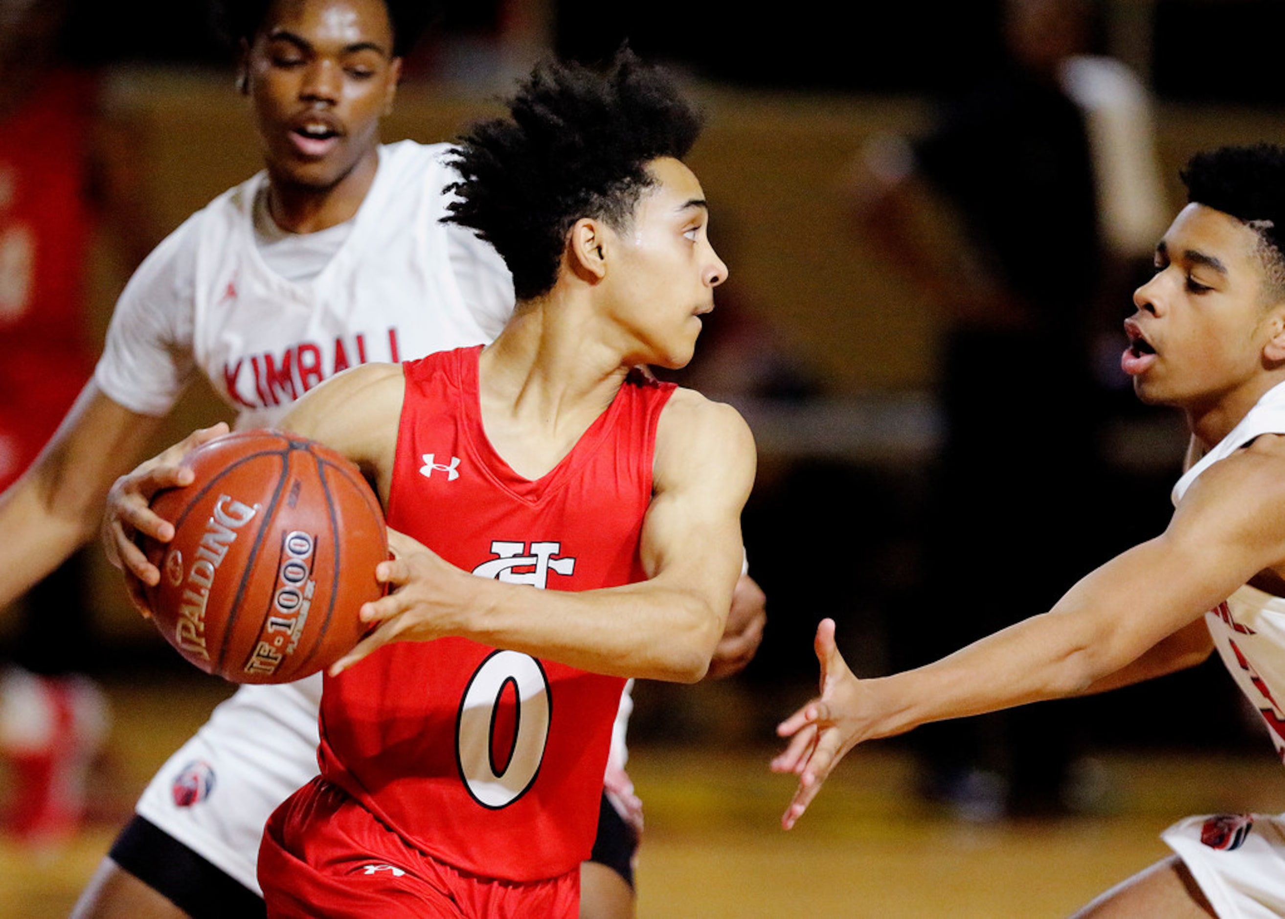 Cedar Hill High School guard Abdul Beyah (0) looks for an outlet to pass the basketball...