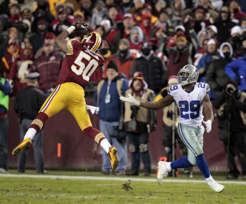 Washington Redskins outside linebacker Rob Jackson (50) intercepts a pass intended for...