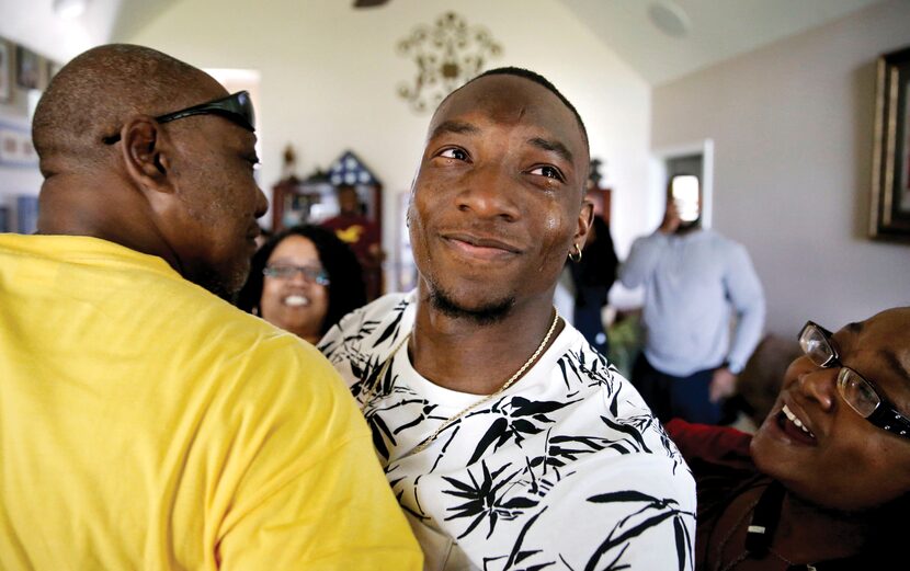 TCU's Derrick Kindred looked up at the TV as he got a hug from his uncle Donald Kindred. The...