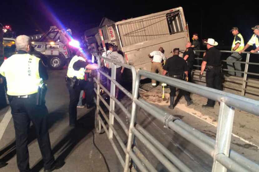 A cattle truck loaded with livestock overturned early Wednesday, shutting down the ramp from...