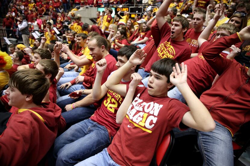 Fans in the Iowa State student section all flop as Oklahoma State guard Marcus Smart is...
